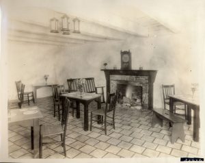 The interior of the east dining room, ca 1925 showing the recently installed ceramic tile floor and chandelier. 