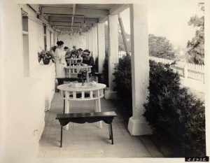 The lower level of the Fort Mackinac Tea Room under the porch of the Officer's Stone Quarters, ca. 1925. Several examples of the unique benches and tables are today preserved in the park's collection. 