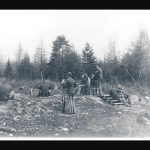 A black and white photo from 1890 showing the Fort Mackinac rifle range, with soldiers participating in a firing drill.